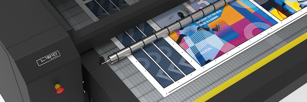 Close-up of the new L1810 Gen 2.6 laser cutter in action, highlighting the extended front conveyor as it precisely cuts sportswear fabric.