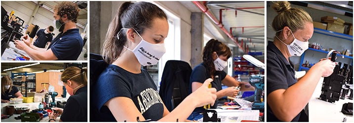 Summa employees wearing mouth masks cut by a Summa laser