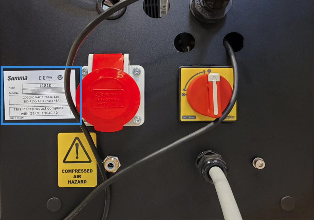 The L Series serial number on the back of the machine, close to the main power switch